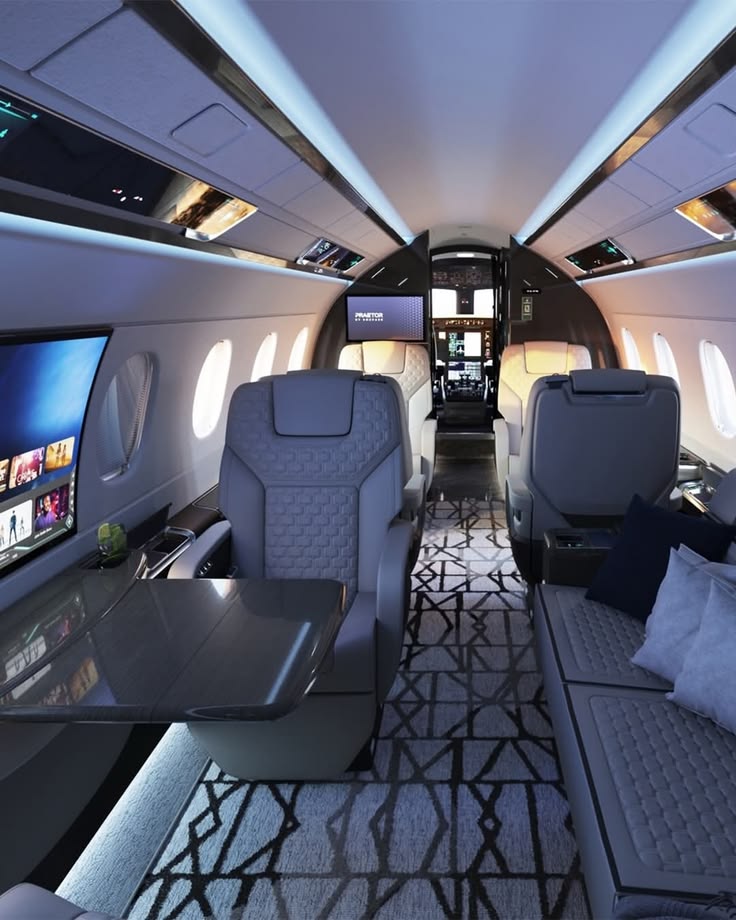 Modern gray aircraft cabin with views toward the cockpit